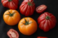 Kaboompics - Colorful Heirloom Tomatoes on a Black Background