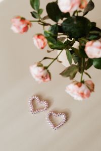 Kaboompics - Blush Roses and Beaded Heart Ornaments on a Neutral Background