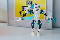 Kaboompics - Toy figurine with a yellow poster