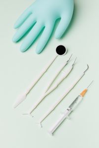 Kaboompics - Dental Exam Instruments and Syringe with Nitrile Glove