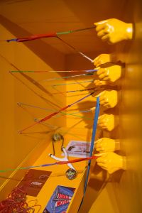 Art installation of plastic hands with rubber bands
