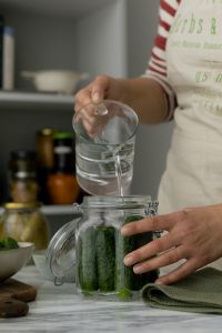 Homemade Cucumber Pickling Preparation with Glass Jars and Kitchen Details
