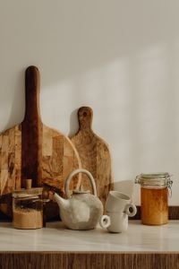 Kaboompics - Vertical Minimalist Kitchen Counter with Ceramic Teapot, Pantry Jars and Copy Space