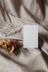 Kaboompics - Portrait Blank Card with Dried Rose on Wrinkled Greige Linen