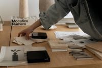 Kaboompics - Designer Selecting Material Samples beside Architectural Drawings