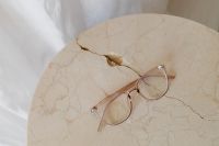 Kaboompics - Rose Gold Eyeglasses on Cracked Marble Table