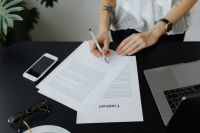 Kaboompics - Overhead View of Contract Signing at Work Desk