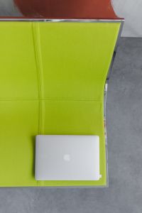 Laptop in a Modern Business Lounge With Lime Green Seating