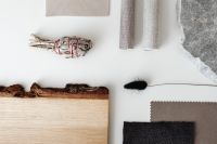 Kaboompics - Interior Material Samples with Wood Board and Black Feather