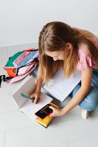 Kaboompics - Math Homework with Phone and Calculator