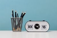 Kaboompics - Close-Up of Desk Clock and Pencil Holder on White Surface
