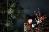 Kaboompics - Christmas Holly and Red Candles with Pine Branch Copy Space on a Wooden Table