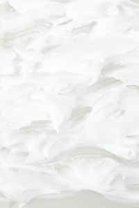 Kaboompics - White Shaving Cream Swirls with Soft Beige Shadows, Minimal Texture Background