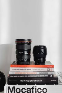 Kaboompics - Photographer's desk - books, DSLR camera and lenses