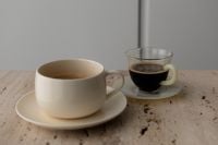 Kaboompics - Two Coffee Cups on Minimalist Travertine Side Table