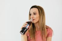 Kaboompics - Young woman with Pepsi Cola bottle