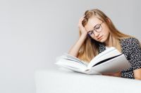 Kaboompics - Teenage Girl Studying from Open Textbook