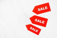 Kaboompics - Red Sale Tags on White Background with Copy Space