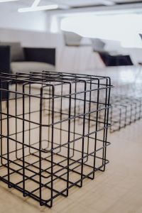 Kaboompics - Black Wire Cube Side Table on a Neutral Contemporary Showroom Floor