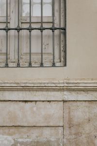 Kaboompics - Barred Window and Stone Wall Background