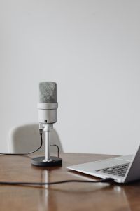 Kaboompics - Silver Studio Microphone on a Stand against White Background for Audio Recording