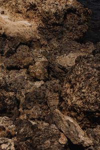 Kaboompics - Dark Rocky Coastline Meeting the Open Sea