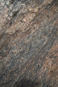 Kaboompics - Diagonal Striations in Gray-Brown Coastal Stone, Fine-Grained Rock Background Texture