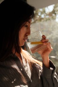 Kaboompics - Woman Relaxing in Bed with a Morning Drink