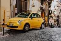 Kaboompics - Yellow Fiat 500 on a Narrow Naples Street