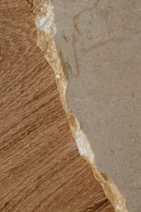 Kaboompics - Close-Up of Irregular Marble Edges Against Warm Oak Grain