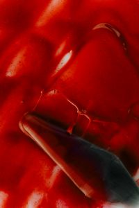 Kaboompics - Red Lip Gloss with Black Applicator Close Up