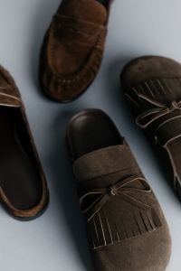 Kaboompics - Brown Suede Slip-On Shoes in Overlapping Composition