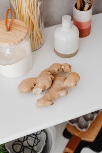 Kaboompics - Glass Jars of Flour and Spaghetti with a White Ceramic Bottle and Wooden Spoons