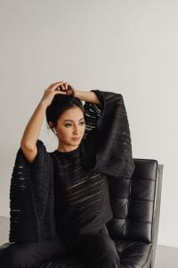 Kaboompics - Asian Businesswoman in Black Suit Sitting in a Leather Chair