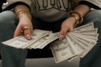 Kaboompics - Hands Holding Dollar Bills Money Manifestation