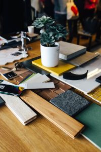 Kaboompics - Designers working with material samples and paper cutouts