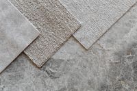 Kaboompics - Overlapping Light Textile Swatches on Stone