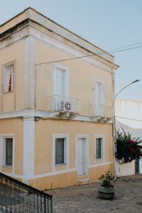 Kaboompics - Cream Townhouse with Balcony and Pink Bougainvillea