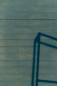 Kaboompics - Blue Wooden Wall With Shadow Pattern