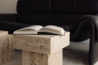 Kaboompics - Black Leather Sofa, Travertine Table and Black Bowl