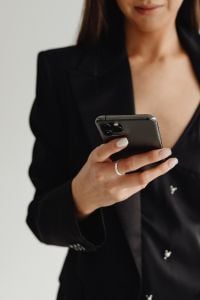 Kaboompics - Close-Up of a Smartphone and Black Blazer