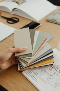 Kaboompics - Hand Holding Laminate Color Sample Swatches for Interior Design