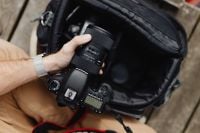 Kaboompics - Photographer holding a DSLR camera