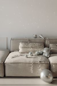 Kaboompics - Gray Couch Party Setup with Mirror Balls, Silver Horn and Ribbons