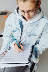 Kaboompics - Close Up of Student Writing Math Notes