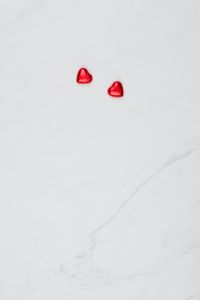 Valentine Background with Red Hearts on a white Marble