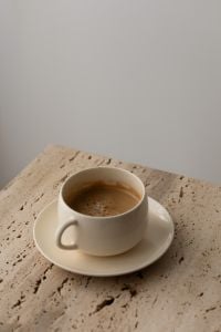 Kaboompics - Minimalist Coffee Cup on Travertine Table With Copy Space