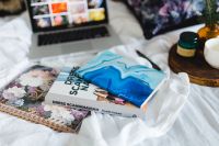 Kaboompics - Bed full of pillows and notebooks with Apple gadgets
