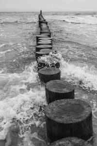 Kaboompics - Close-Up Waves Breaking Over Wooden Groynes