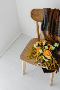 Kaboompics - Wooden Chair With Autumn Flowers and Pumpkin
